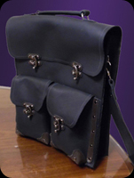 Leather bag with two front pouches.  Converts from shoulder bag to backpack.